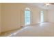 Spacious bedroom with neutral carpet and two arched windows at 1357 Baniff Ct, Snellville, GA 30078