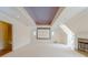 Spacious living room featuring a movie screen, fireplace, and plush carpeting at 1357 Baniff Ct, Snellville, GA 30078