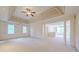Open main bedroom with coffered ceilings, columns and neutral carpet at 1357 Baniff Ct, Snellville, GA 30078