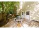 Stone patio offers a private retreat, complemented by lush landscaping and convenient access to the home's exterior at 1357 Baniff Ct, Snellville, GA 30078