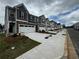 New construction townhomes featuring modern design with attached garages and well-manicured landscaping at 328 Elgin Dr, Lawrenceville, GA 30045