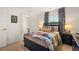 This bedroom features carpet, a window and ensuite bathroom at 308 Elgin Dr, Lawrenceville, GA 30045