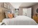 This bedroom features a neutral paint color, large window and carpet at 308 Elgin Dr, Lawrenceville, GA 30045
