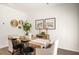 The dining room features a rustic wood table and modern decor for stylish entertaining at 308 Elgin Dr, Lawrenceville, GA 30045