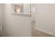 Bright hallway leading to other rooms in the home with neutral carpet flooring and white walls at 308 Elgin Dr, Lawrenceville, GA 30045