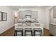 Kitchen featuring granite countertops, stainless steel appliances, and three counter stools at 308 Elgin Dr, Lawrenceville, GA 30045