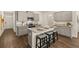 Kitchen with island, granite countertop, stainless steel appliances and gray cabinets at 308 Elgin Dr, Lawrenceville, GA 30045