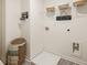 Functional laundry room with decor and ample space for laundry appliances and storage at 308 Elgin Dr, Lawrenceville, GA 30045