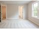 Bright bedroom with bathroom access and view to hallway at 1956 Deco Dr, Kennesaw, GA 30144