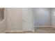 Interior view of a room with a door and stairs, featuring light wood flooring and neutral wall paint at 1956 Deco Dr, Kennesaw, GA 30144