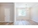 Open kitchen features an island, stainless appliances, and pendant lighting at 1956 Deco Dr, Kennesaw, GA 30144