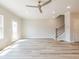 Living room features light floors, a ceiling fan, and access to stairs at 1956 Deco Dr, Kennesaw, GA 30144