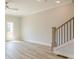 Light-filled living room features stylish ceiling fan at 1956 Deco Dr, Kennesaw, GA 30144