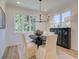 Bright dining room with an oval table, four chairs, and a large window at 1996 Deco Dr, Kennesaw, GA 30144