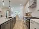 Modern kitchen with stainless steel appliances and white cabinets at 1996 Deco Dr, Kennesaw, GA 30144
