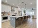 Open concept kitchen with large island and breakfast bar at 1996 Deco Dr, Kennesaw, GA 30144