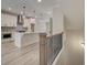 Open concept kitchen with white cabinets and gray island at 1996 Deco Dr, Kennesaw, GA 30144