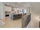 Open concept kitchen with island, stainless steel appliances, and white cabinets at 1996 Deco Dr, Kennesaw, GA 30144