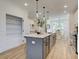 Open concept kitchen with island and walk-in pantry at 1996 Deco Dr, Kennesaw, GA 30144