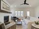 Bright living room with fireplace, hardwood floors, and open floor plan at 1996 Deco Dr, Kennesaw, GA 30144