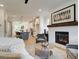 Bright living room featuring hardwood floors, fireplace, and seamless open layout with kitchen access at 1996 Deco Dr, Kennesaw, GA 30144