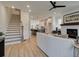 Open living room features a cozy fireplace and flows into the kitchen at 1996 Deco Dr, Kennesaw, GA 30144