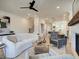 Spacious living room with fireplace and view into kitchen at 1996 Deco Dr, Kennesaw, GA 30144