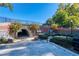 Brick pedestrian tunnel pathway with scenic murals and landscaping at 1996 Deco Dr, Kennesaw, GA 30144