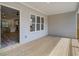 Covered porch with access to kitchen and open concept living area at 1996 Deco Dr, Kennesaw, GA 30144