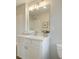 Light and airy bathroom featuring a white vanity with a large mirror at 1980 Deco Dr, Kennesaw, GA 30144