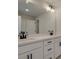 Elegant bathroom featuring double sinks, sleek black hardware, and spacious countertop at 1980 Deco Dr, Kennesaw, GA 30144