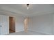 Bright bedroom with neutral carpet, tray ceiling, and multiple doors for convenient access at 1980 Deco Dr, Kennesaw, GA 30144