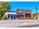 Inviting brick building with blue accents hosting Eaton Chiropractic and The Venue on Main at 1980 Deco Dr, Kennesaw, GA 30144