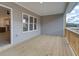 Outdoor wooden deck with gray siding, a view of the neighborhood, and access to the home's interior at 1980 Deco Dr, Kennesaw, GA 30144