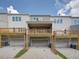 Backyard of townhomes with garages and decks at 1980 Deco Dr, Kennesaw, GA 30144