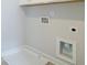 Simple laundry room featuring hookups, a white utility sink and light gray walls at 1980 Deco Dr, Kennesaw, GA 30144