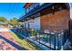 Cozy outdoor patio with black metal railing and colorful seating at restaurant at 1980 Deco Dr, Kennesaw, GA 30144