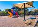 Community playground featuring colorful slides, climbing structures, and picnic benches at 1980 Deco Dr, Kennesaw, GA 30144