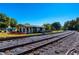 View of the railroad tracks and the exterior of the building on a clear day at 1980 Deco Dr, Kennesaw, GA 30144