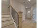 Staircase with light wood treads, white risers, and a black metal railing leading to the upper level at 1980 Deco Dr, Kennesaw, GA 30144
