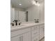 Bathroom with double vanity featuring a quartz countertop and modern fixtures at 1988 Deco Dr, Kennesaw, GA 30144