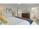Stylish bedroom with a cozy bed, modern decor, and a view into the ensuite bathroom, creating a comfortable space at 1988 Deco Dr, Kennesaw, GA 30144