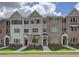 Charming townhome exteriors with brick and siding, complemented by well-maintained landscaping and inviting entryways at 1988 Deco Dr, Kennesaw, GA 30144