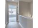 Bright hallway with hardwood floors and an open view to a room with large windows at 1988 Deco Dr, Kennesaw, GA 30144