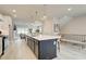 Open concept kitchen features large island, stainless steel appliances and eat in barstool seating at 1988 Deco Dr, Kennesaw, GA 30144