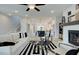 Bright, open living room with fireplace, modern furnishings, and hardwood floors flowing into the kitchen at 1988 Deco Dr, Kennesaw, GA 30144