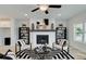Cozy living room featuring a fireplace, modern decor, and comfortable seating for a welcoming atmosphere at 1988 Deco Dr, Kennesaw, GA 30144