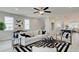 Cozy living room featuring a striped rug, neutral palette and modern furniture leading to the dining area at 1988 Deco Dr, Kennesaw, GA 30144