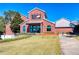 A red brick building is surrounded by a lush lawn with meticulously maintained landscaping at 1988 Deco Dr, Kennesaw, GA 30144