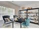 Cozy office space with a modern desk, comfortable chairs, and stylish shelving at 1988 Deco Dr, Kennesaw, GA 30144